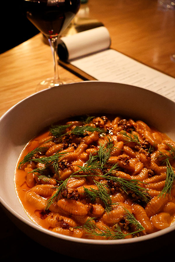Carrot Cavatelli with butter, chili crisp, buckwheat and dill at Ratafia wine bar and gourmet desserts
