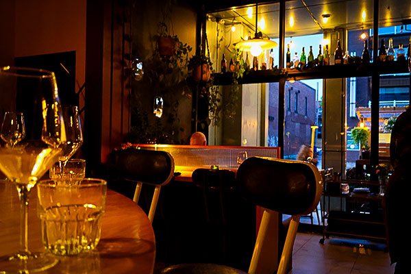 The magnificent glass wall and terrace (patio) in the back at Ratafia wine bar and gourmet desserts