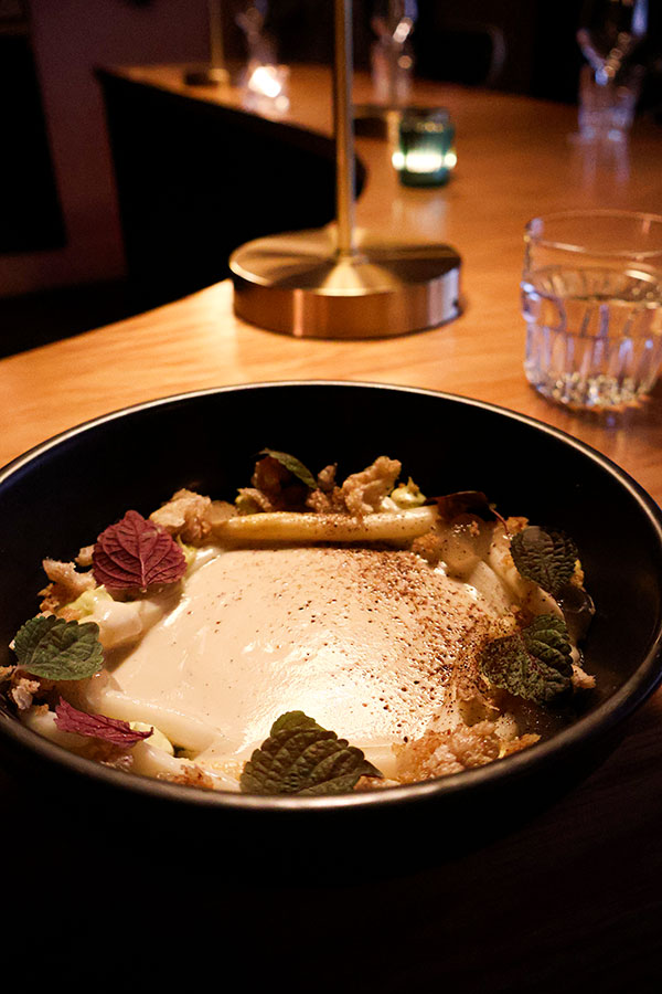 White asparagus with vanilla, shiso, Champagne vinegar and chicharrón at Ratafia wine bar and gourmet desserts