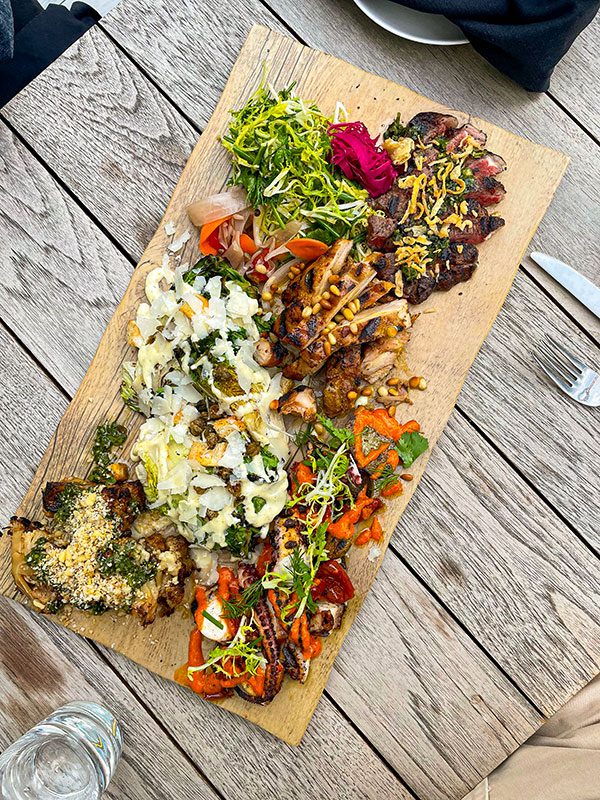 A platter of food served on the Nacarat patio