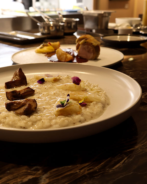 Truffled Risotto with Porcini mushrooms and Reggiano cheese, celeriac and camelina oil and Guinea fowl from Saint-Georges Besnier Farm with pistachios, shallot confit, squash and Québec apples