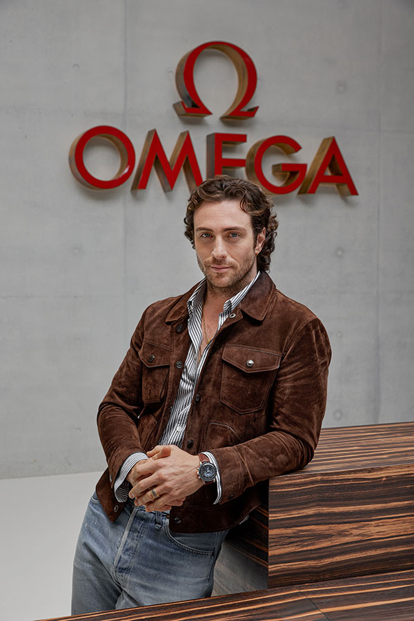 Aaron Taylor-Johnson visits OMEGA to formalize his new role as spokesperson for the Swiss watchmaker