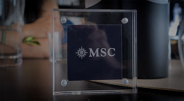 F1 Paddock Club in BWT Alpine F1 VIP box with MSC Cruises at the Canadian Grand Prix - The MSC Cruises logo on our table