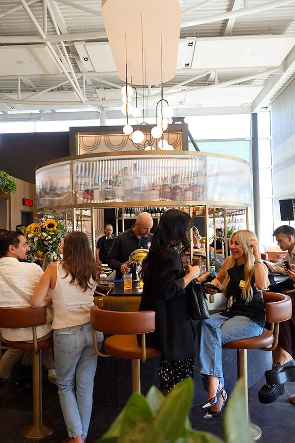 The bar full of clients at the media day of the Aspire Amex Lounge at YUL Montréal-Trudeau International Airport