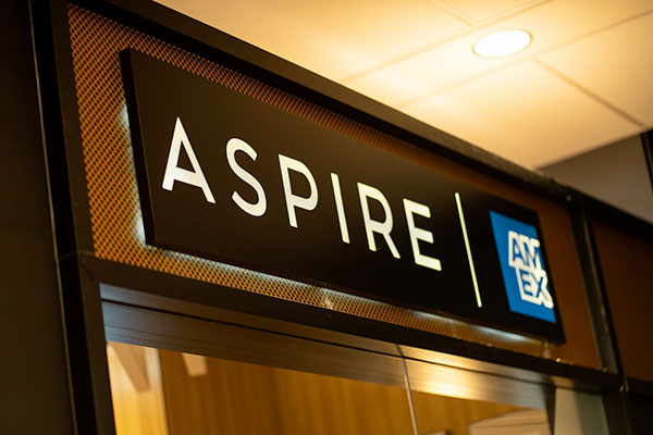 The Aspire and American Express logos at the entrance to the lounge