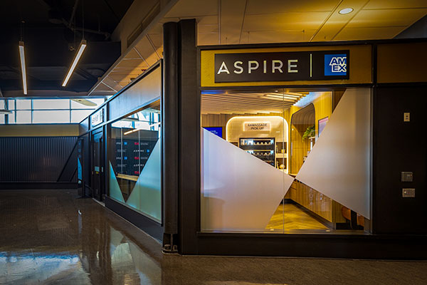 The entrance of the Aspire Amex Lounge at YUL Montréal-Trudeau International Airport