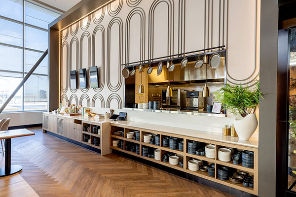 The kitchen and the service area at the Aspire Amex Lounge at YUL Montréal-Trudeau International Airport