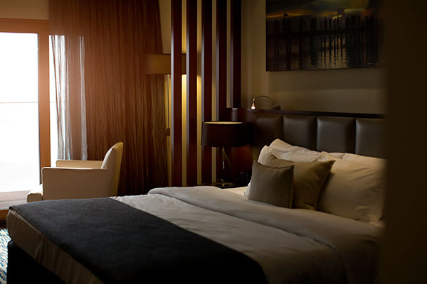 How to Furnish Your Home Like a Gentleman - Dark bedroom