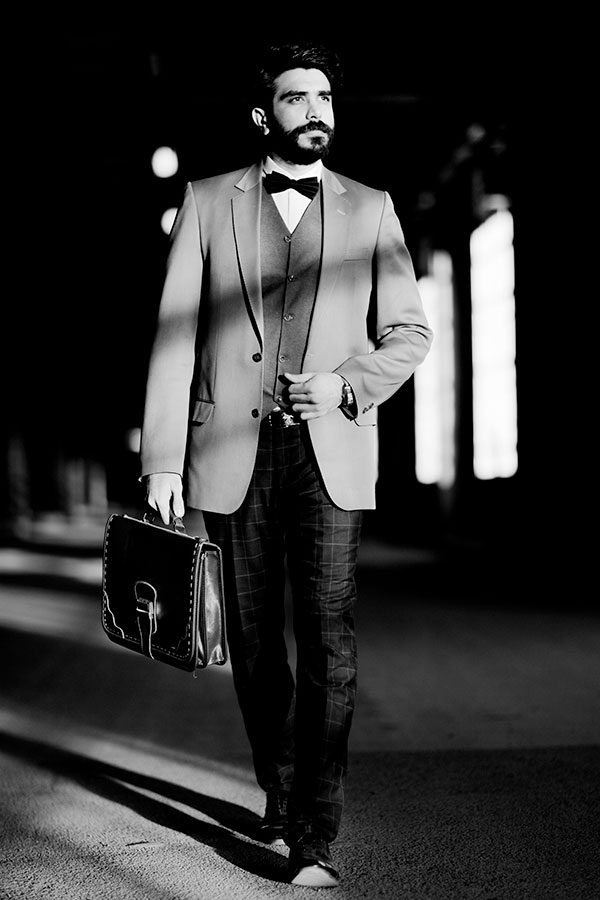 Man in a suit with an handle briefcase